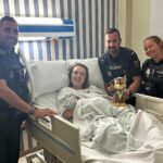 Police officers visit family after helping deliver baby in Marbella street